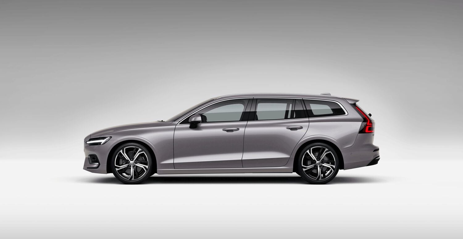 Gray Volvo V60 car left facing with grey shadow background