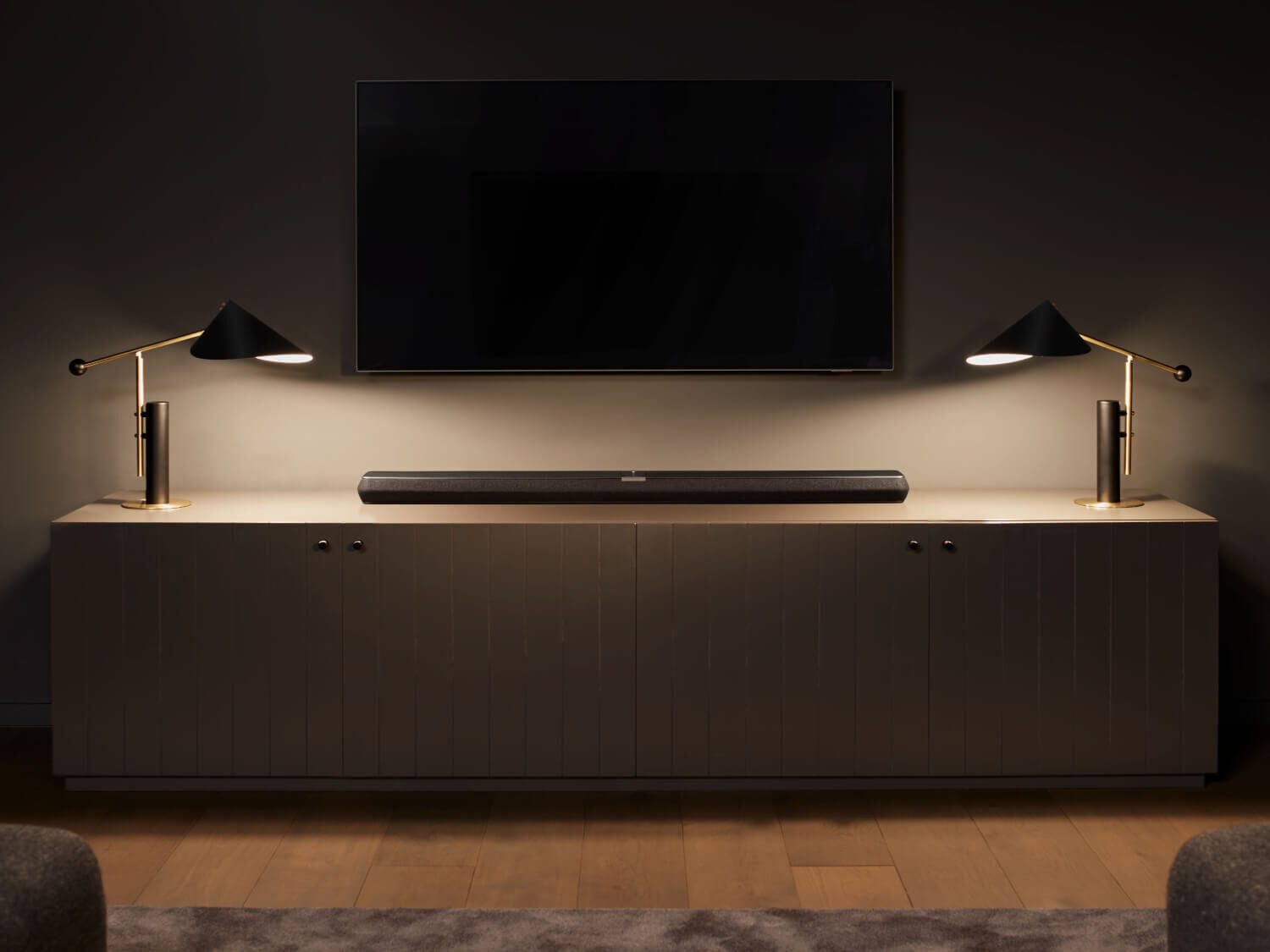 Dark living room with soundbar on media console