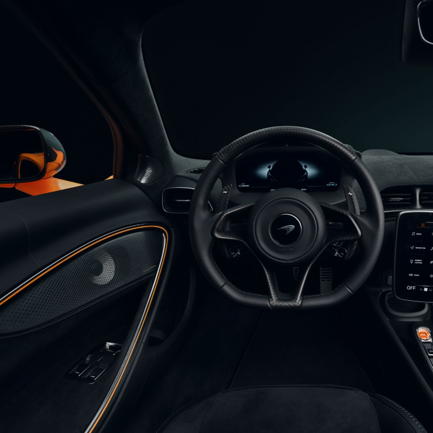 Interior of McLaren car with black leather and orange accents