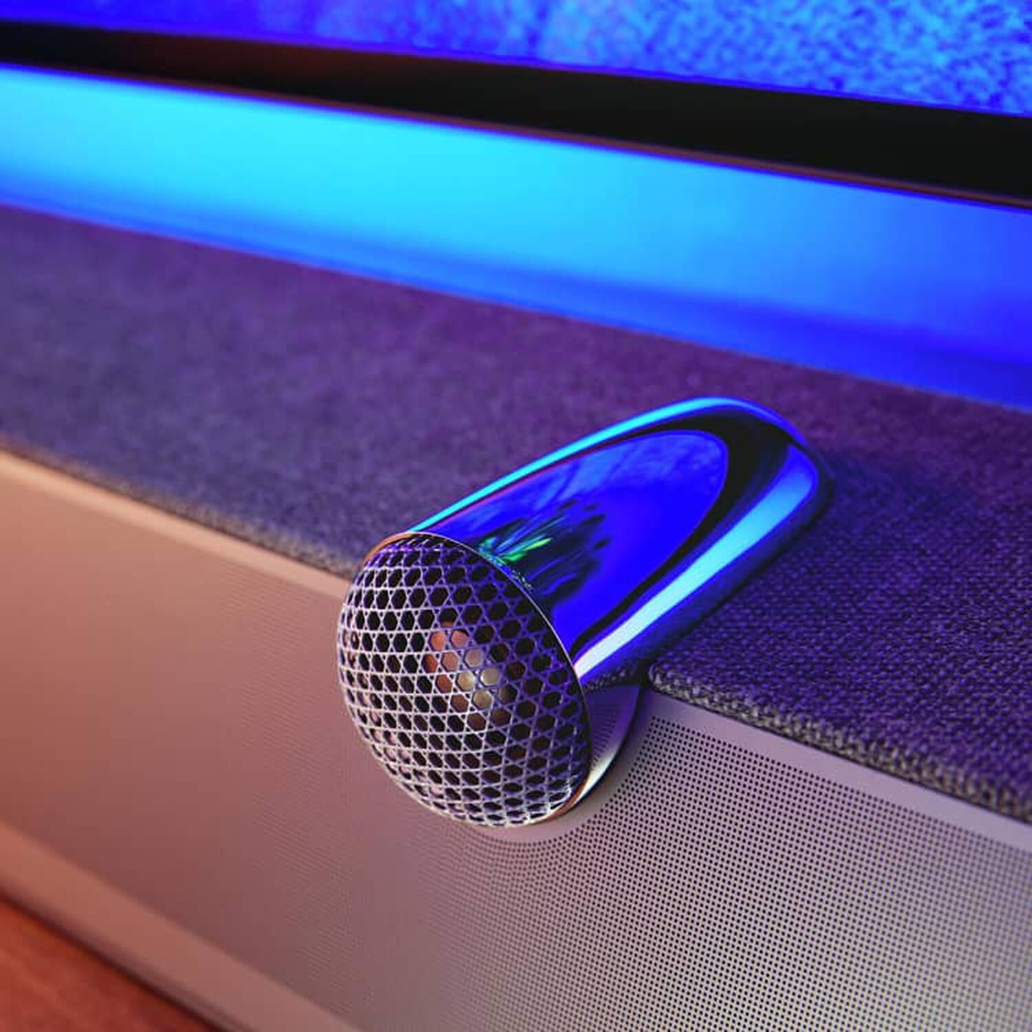 White and silver speaker with blue illuminated background
