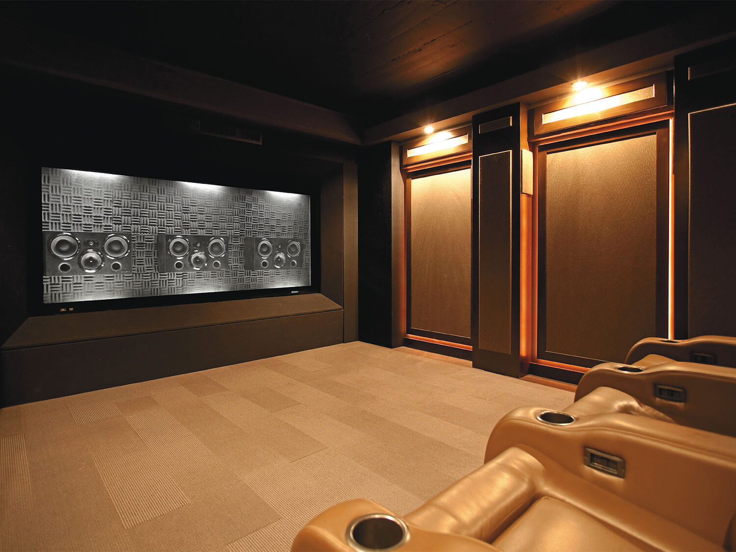 Home theater with speakers behind movie screen