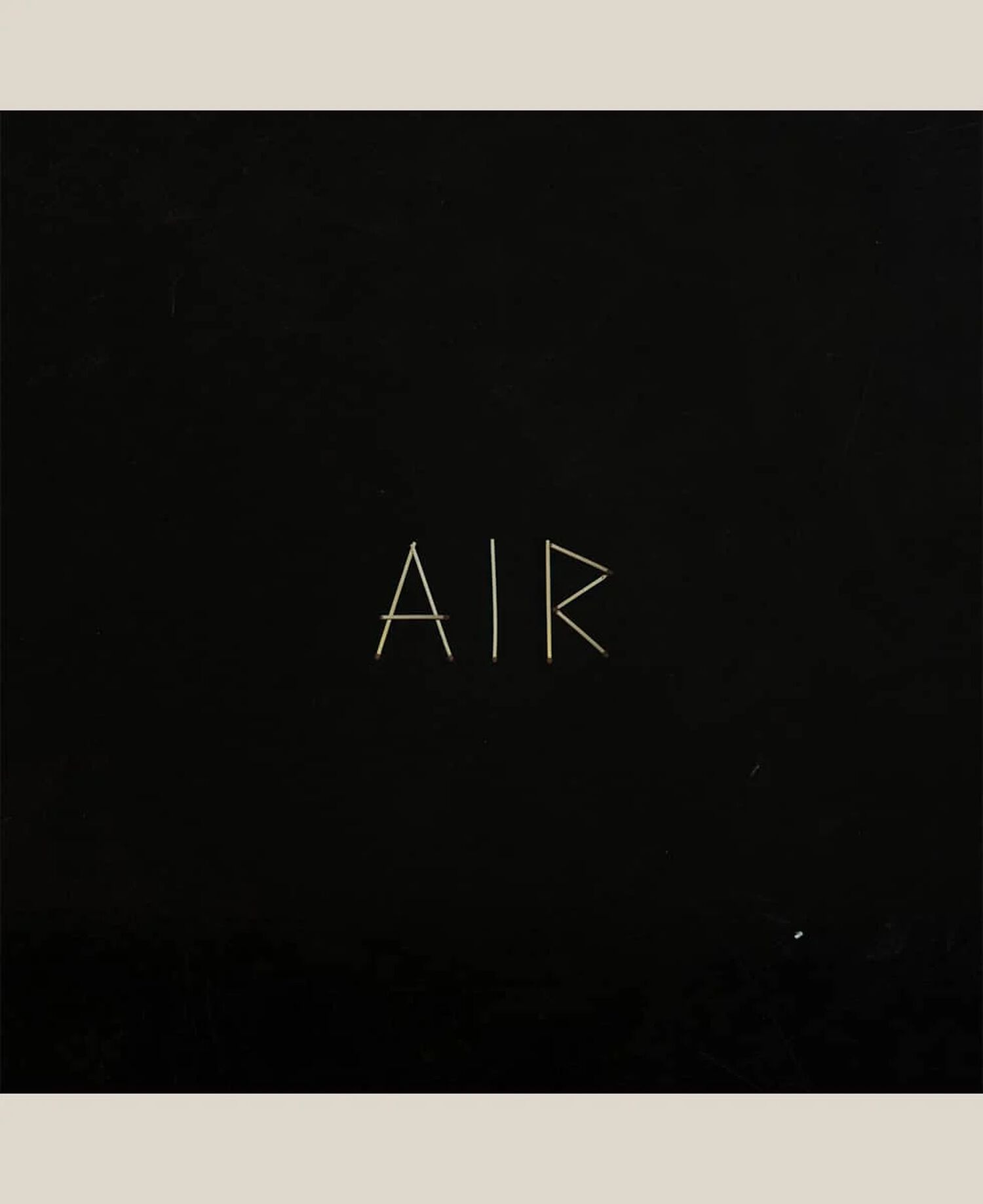 Black square with thin white text