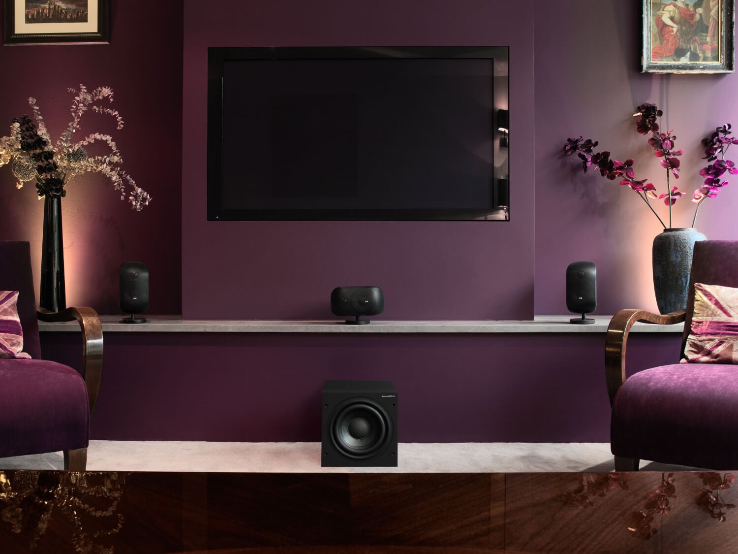 Mini Theater setup in a purple room beneath a television