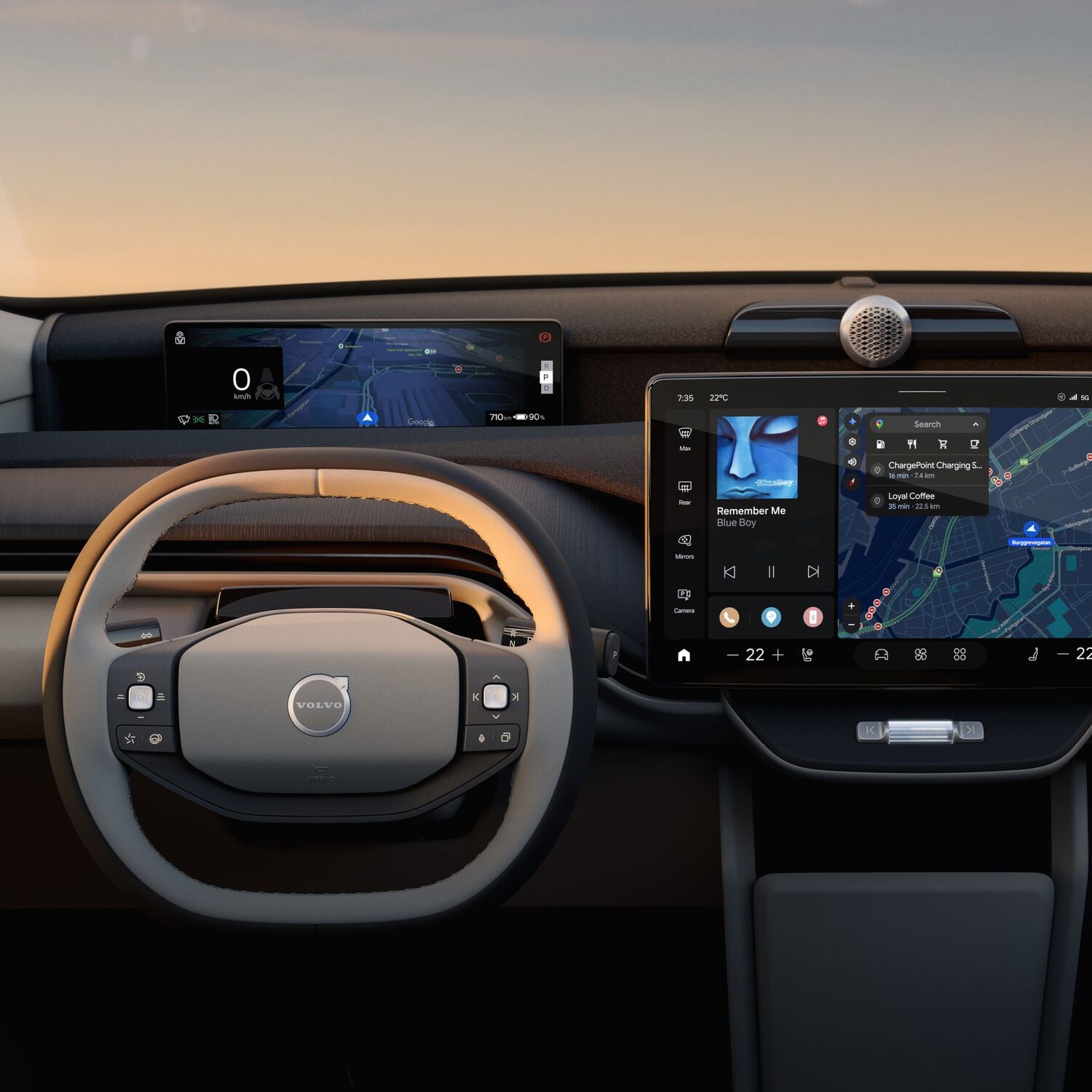 Interior of Volvo car dashboard and tan leather steering wheel