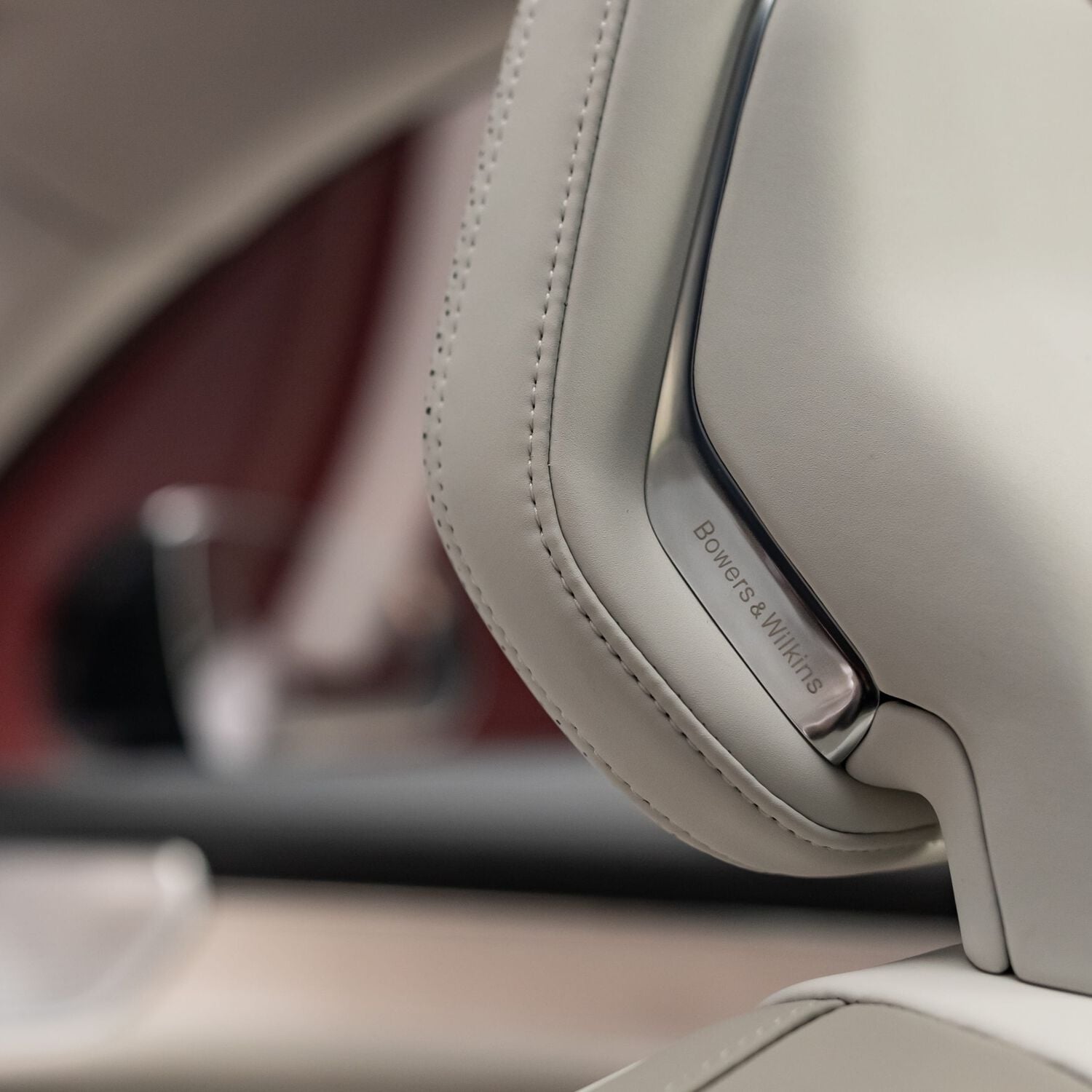 Tan leather car seat with silver Bowers & Wilkins speakers inset