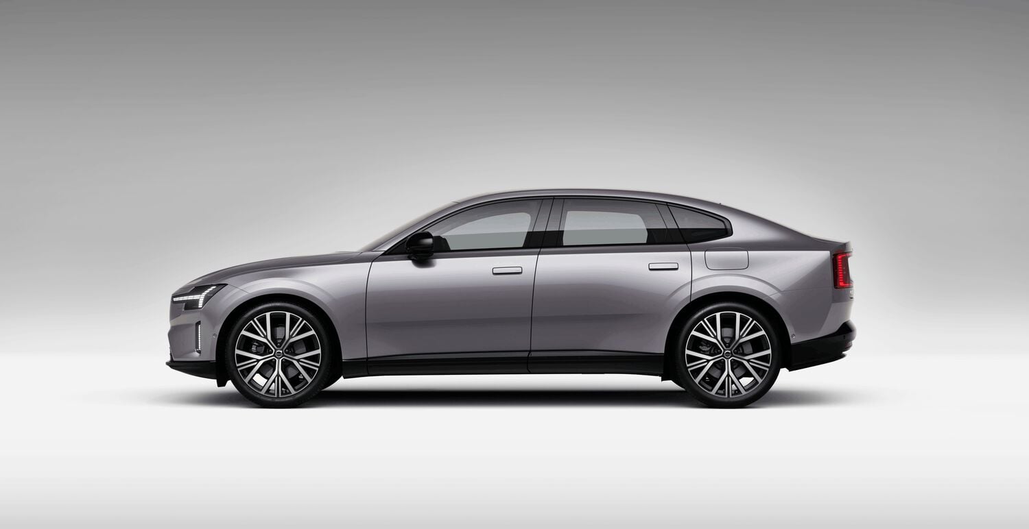 Gray Volvo ES90 car left facing with grey shadow background