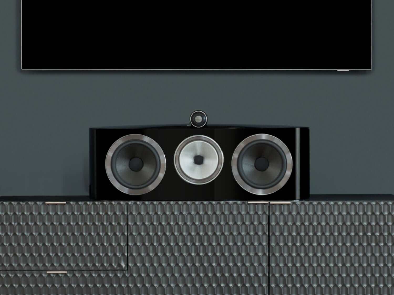 One black HTM82 D4 on a shelf under a television