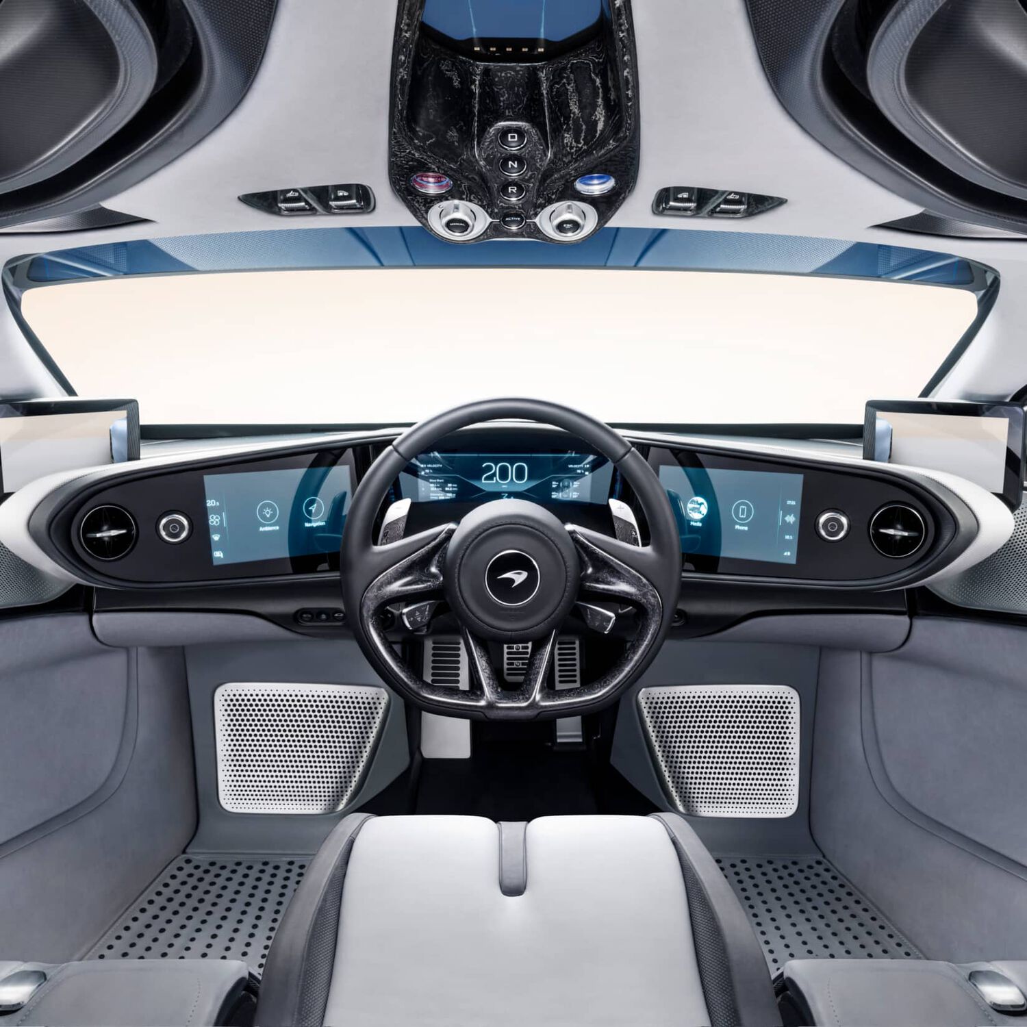 Interior of McLaren car with digital screens and grey interior