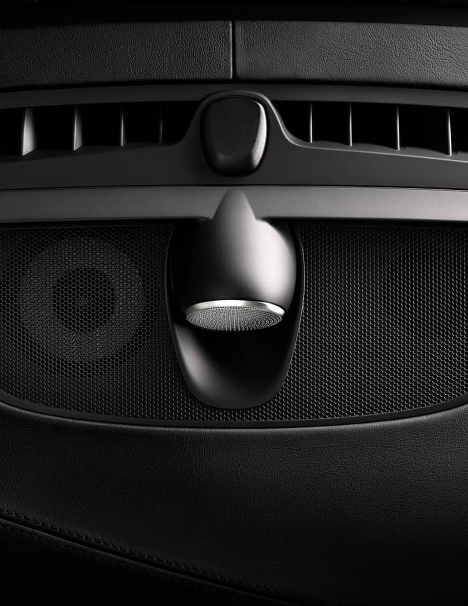 Ariel photo of black car dashboard with car speakers