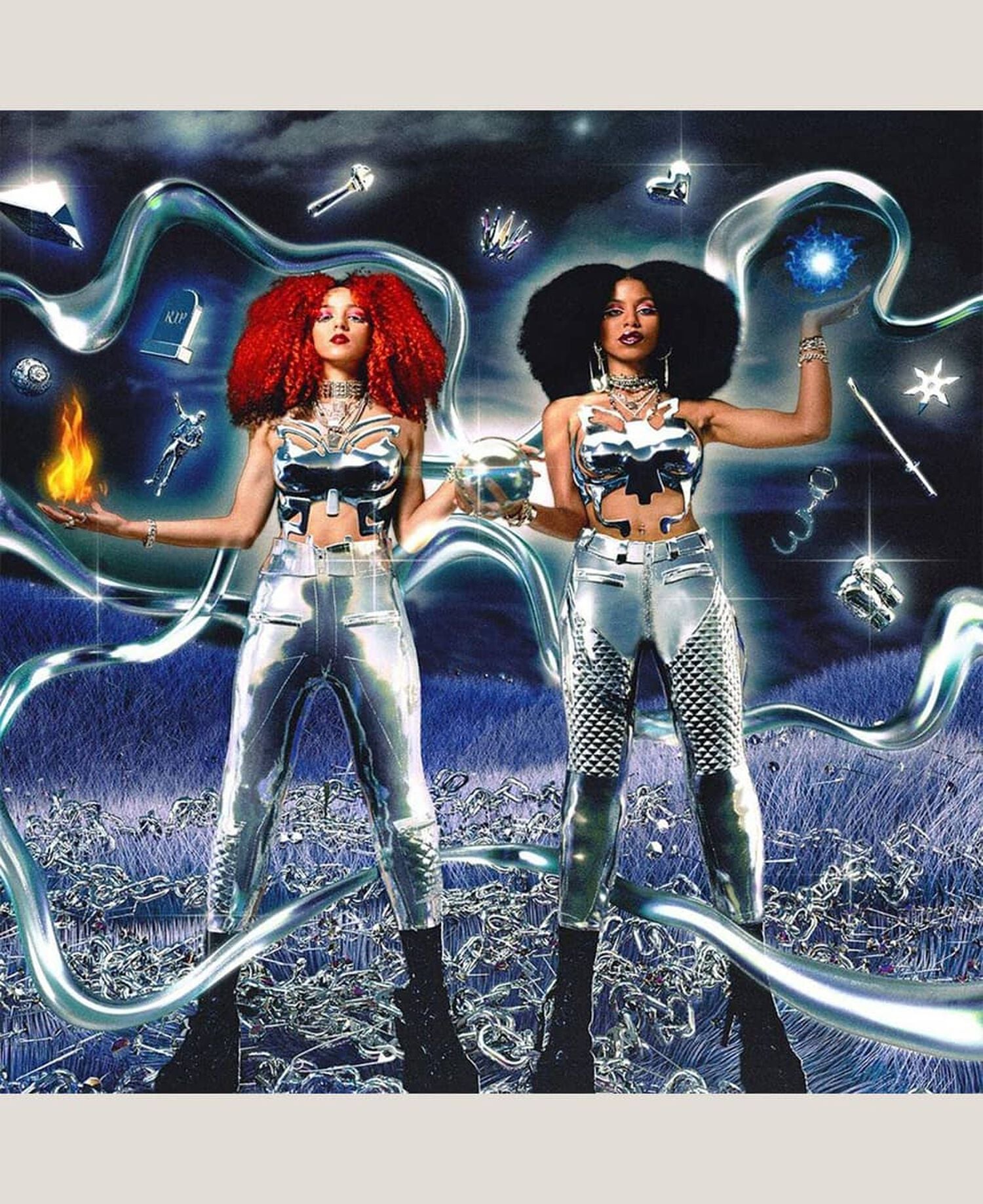 2 women wearing silver outfits surrounded by silver floating objects