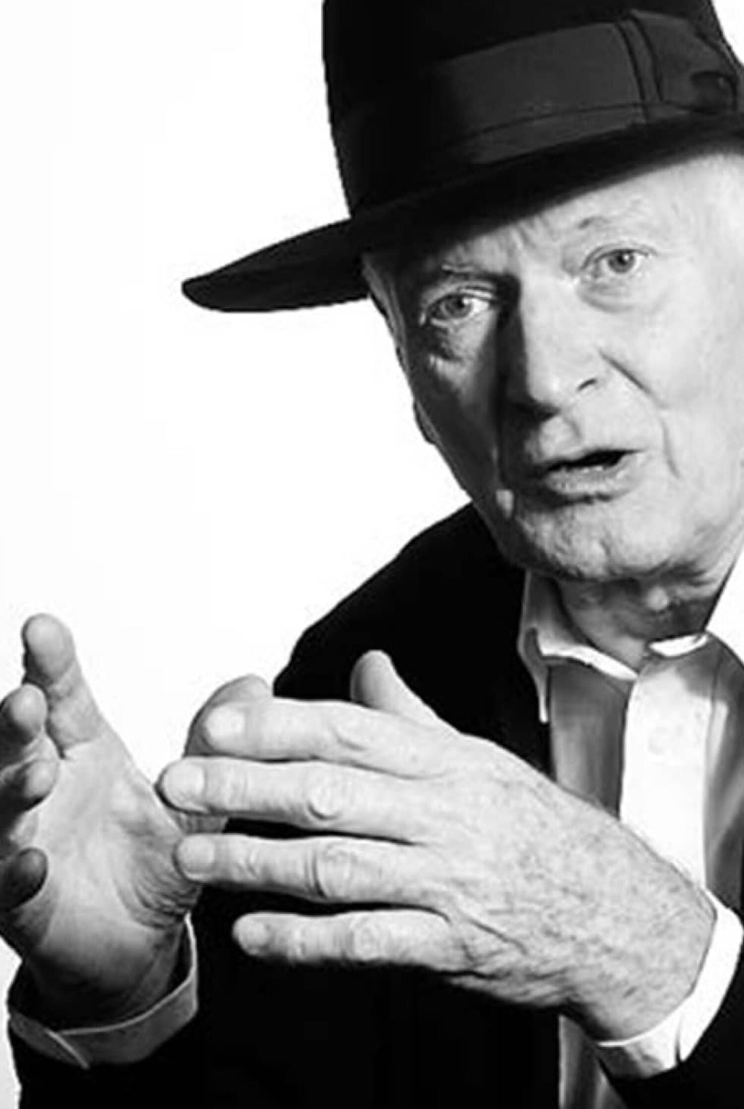 Black and white photo of man speaking wearing top hat