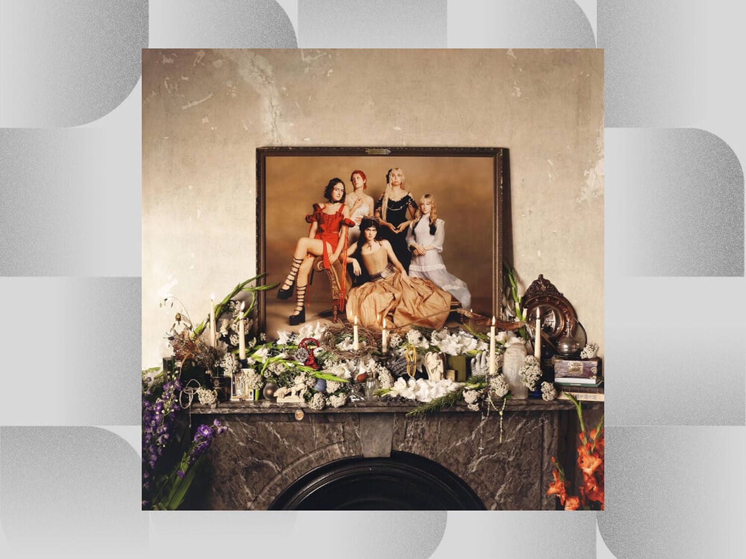 Mantle covered in flowers and candles with painting of woman above