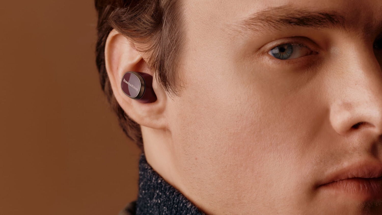 Man facing right wearing dark burgundy Pi8