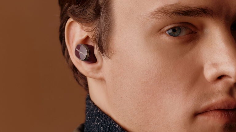 Man facing right wearing dark burgundy Pi8