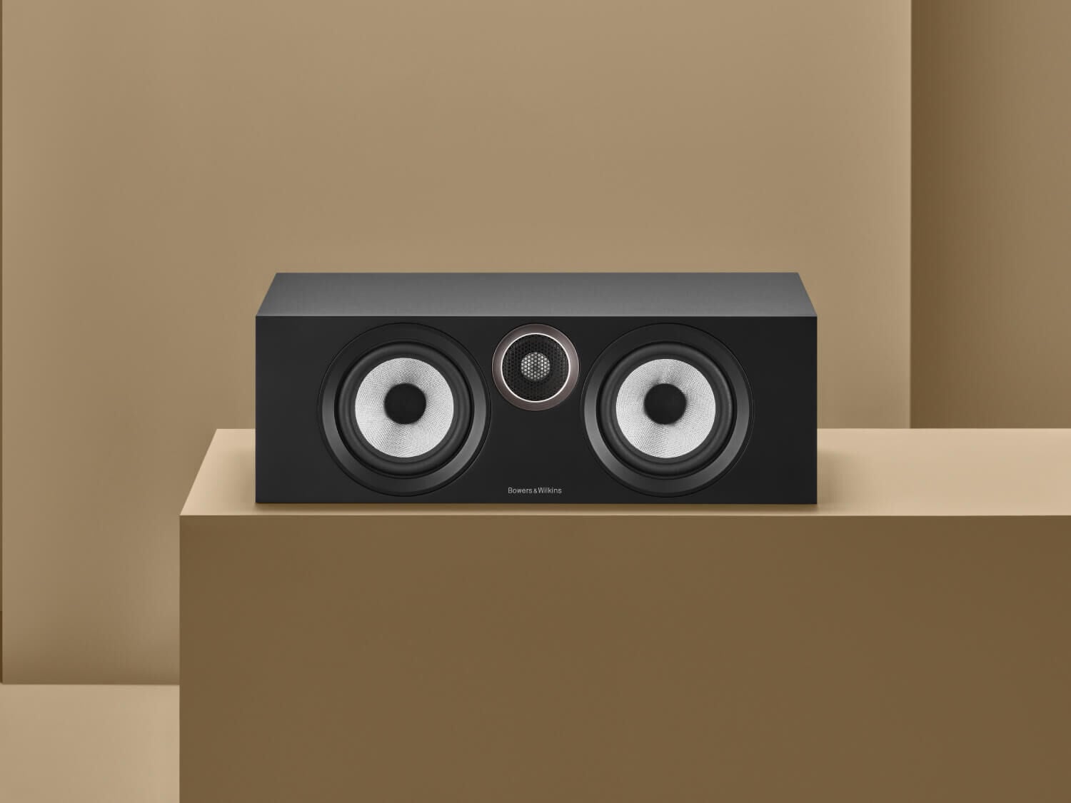 One black HTM6 S3 on tan background