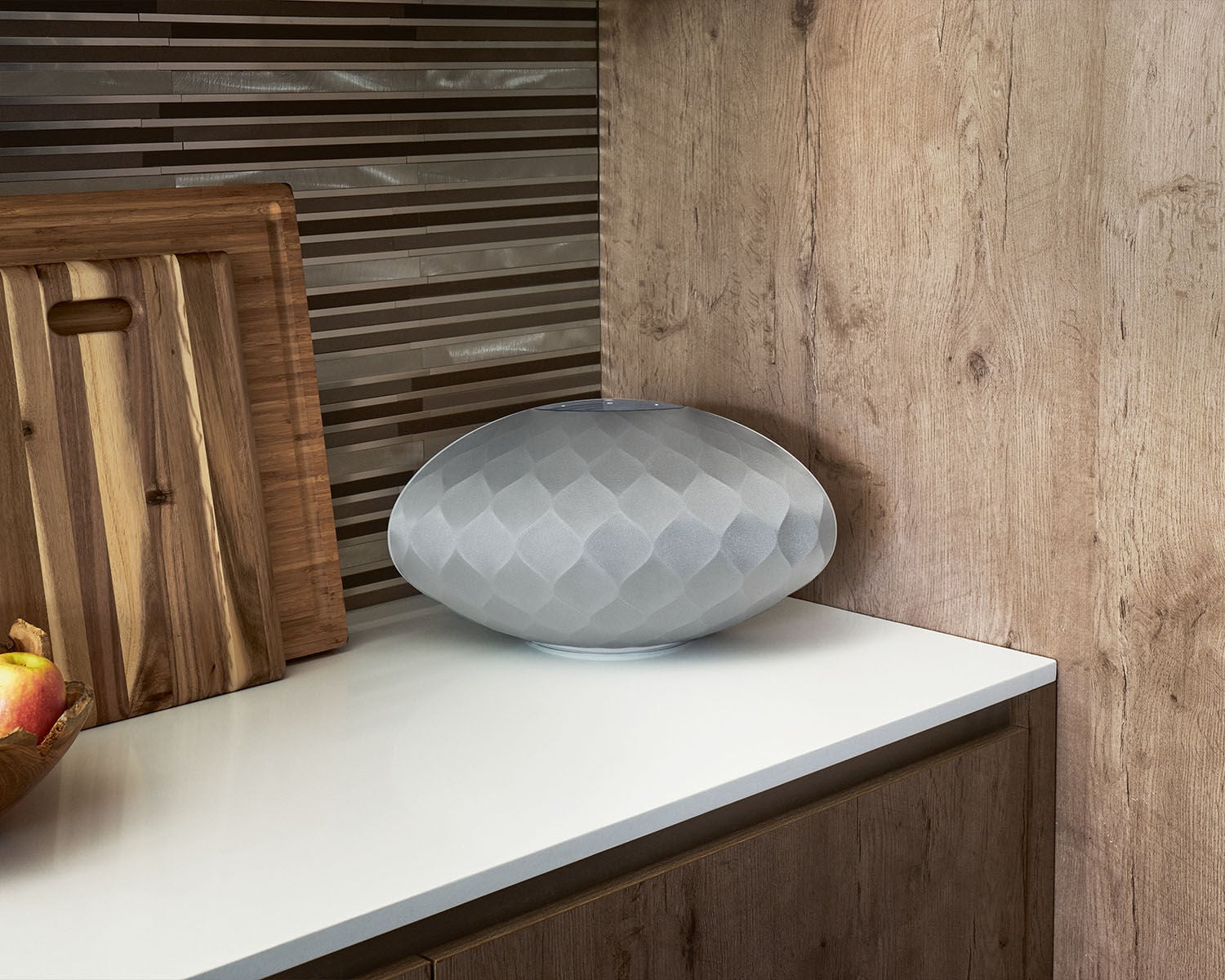 Silver speaker on kitchen counter