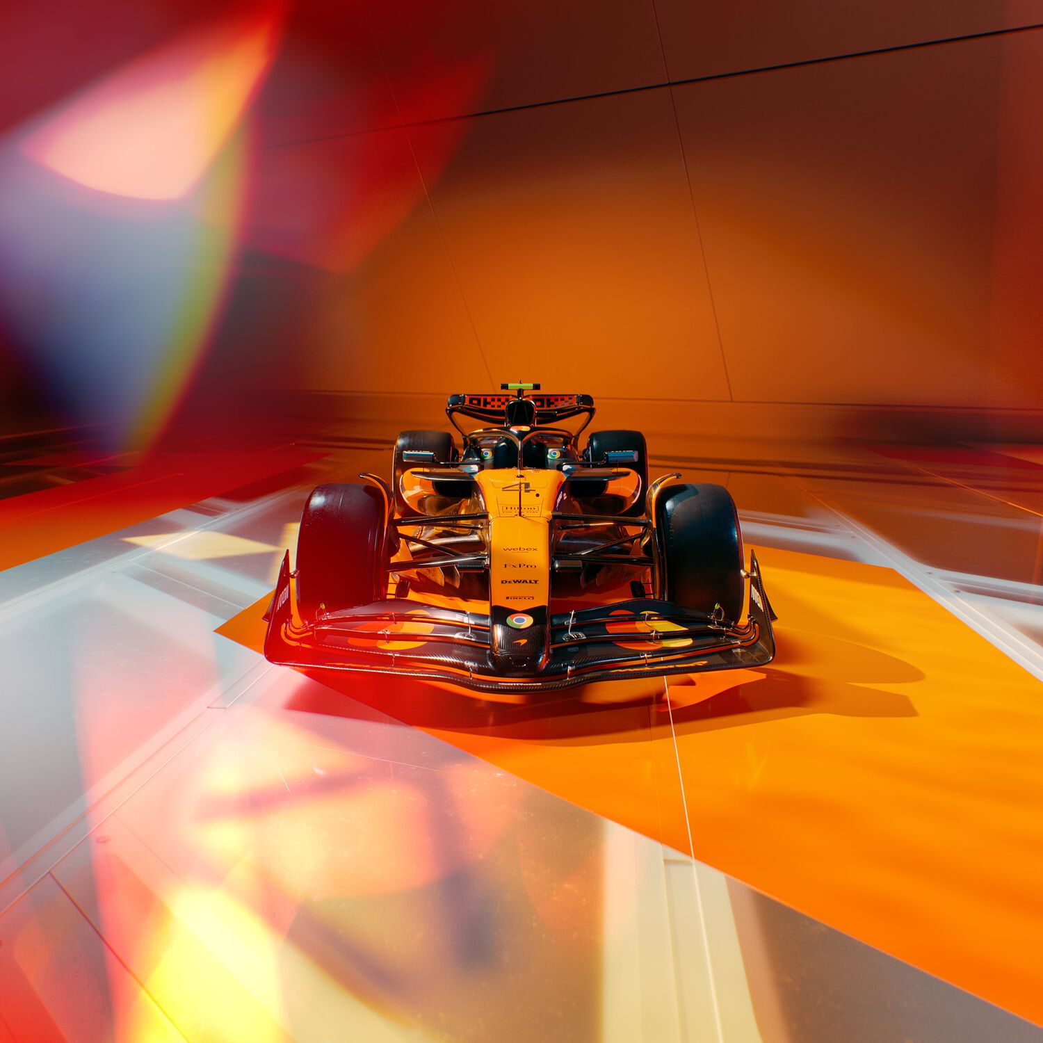 Orange F1 McLaren car with orange background