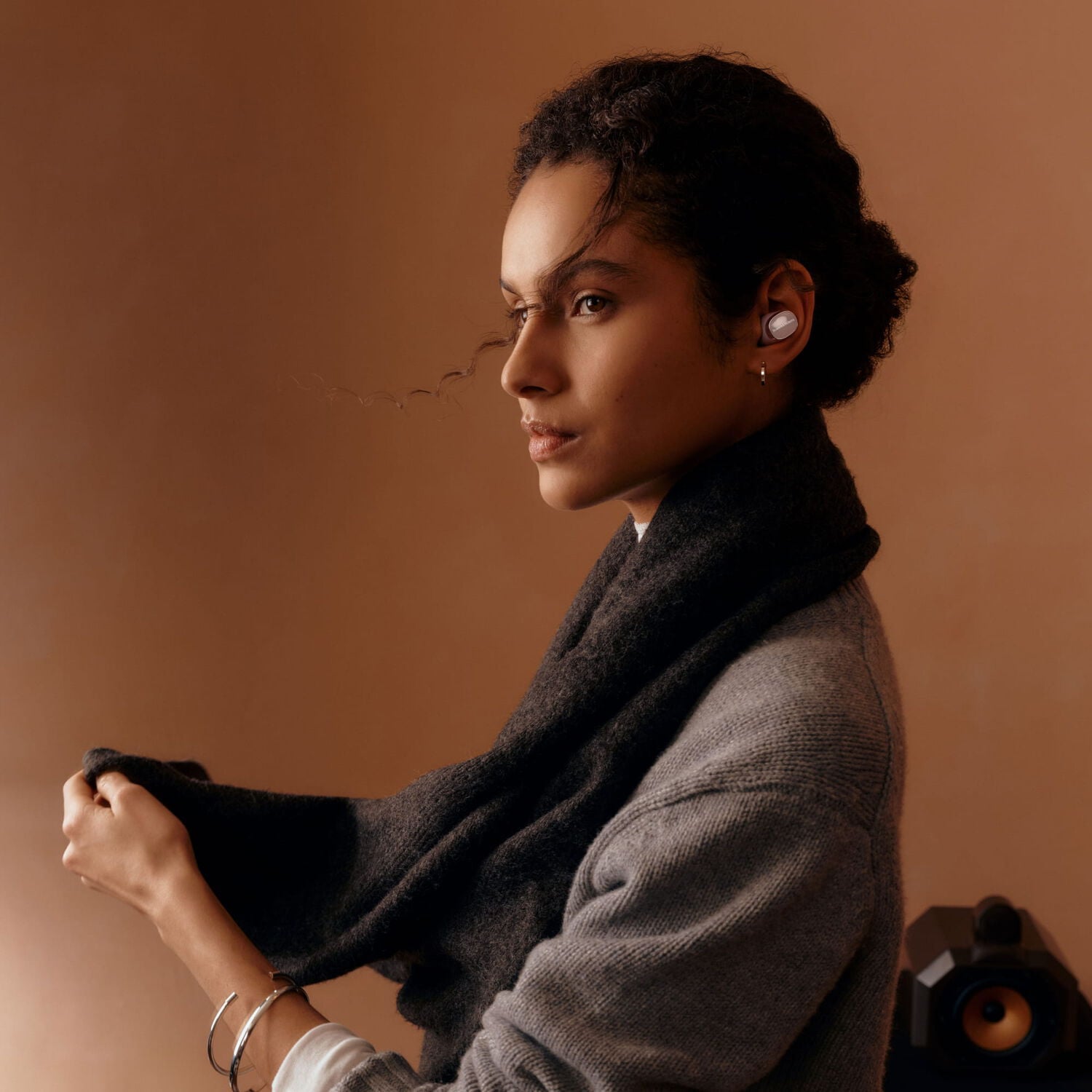 Women facing diagonal left wearing in ear wireless earbuds