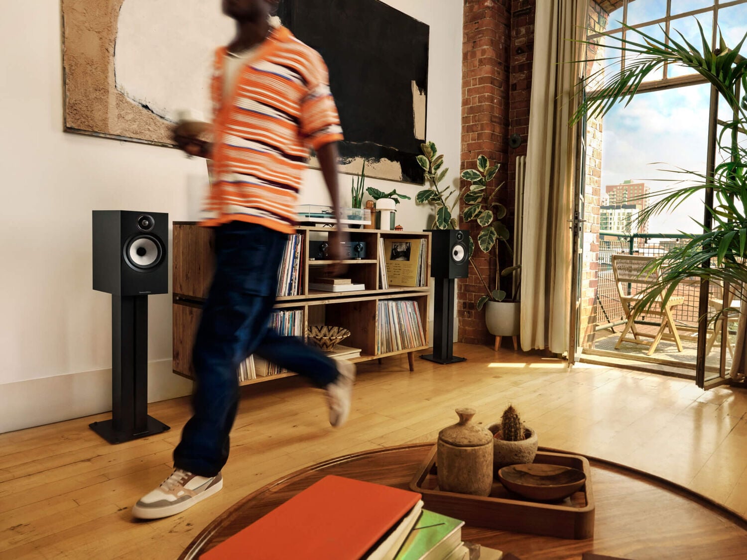 Man walking by 600 series setup in home living room