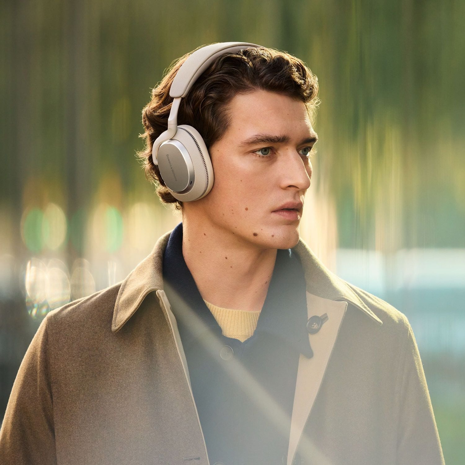 Hear the playlist - man wearing over-ear headphones facing diagonal right