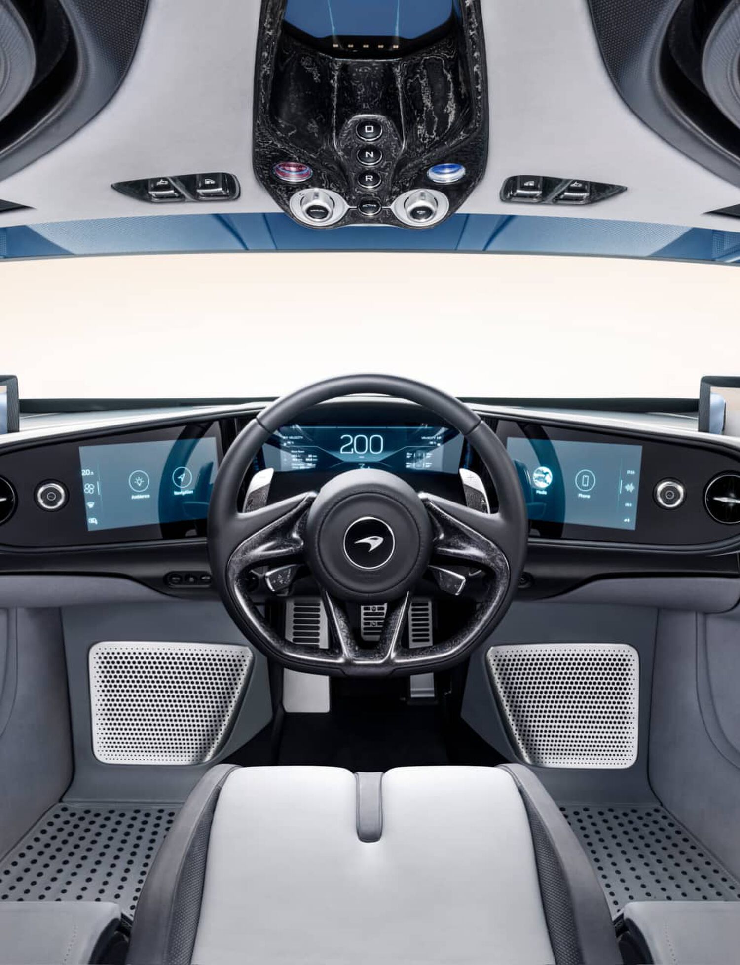 Interior of McLaren car with digital screens and grey interior