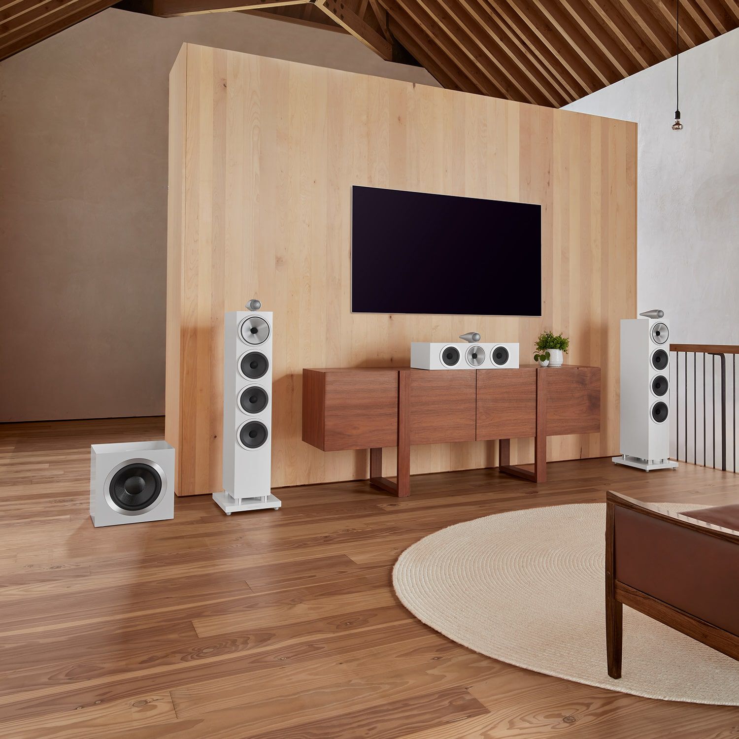 White DB Series on a brown table under a television