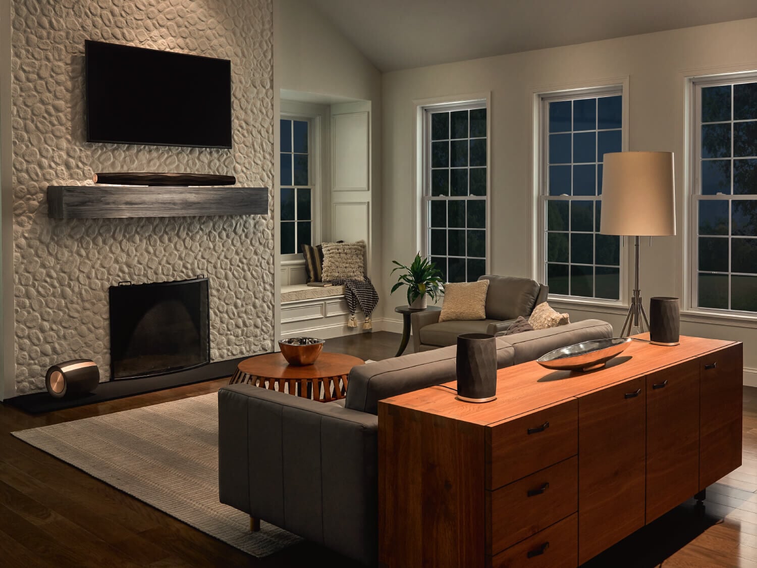 Wireless Home Theater setup in a living room with a mounted television and large windows