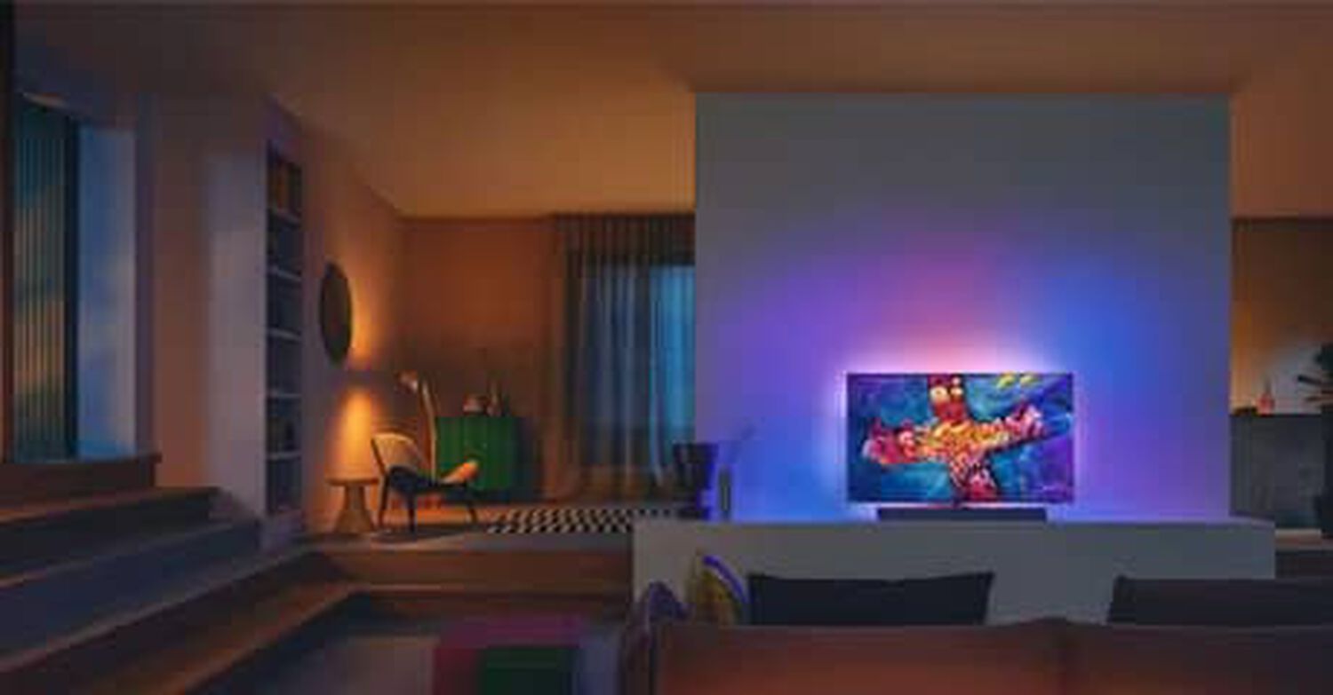 Philips OLED+937 in living room with purple, blue and orange lights behind TV