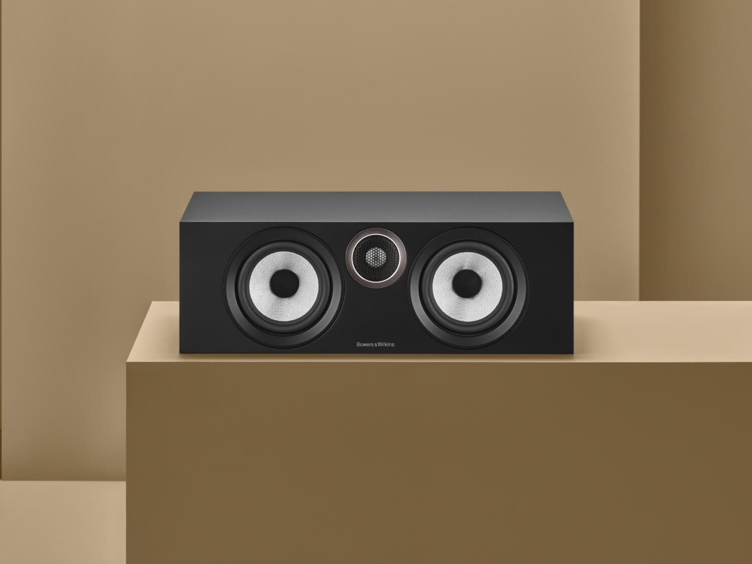 One black HTM6 S3 on tan background