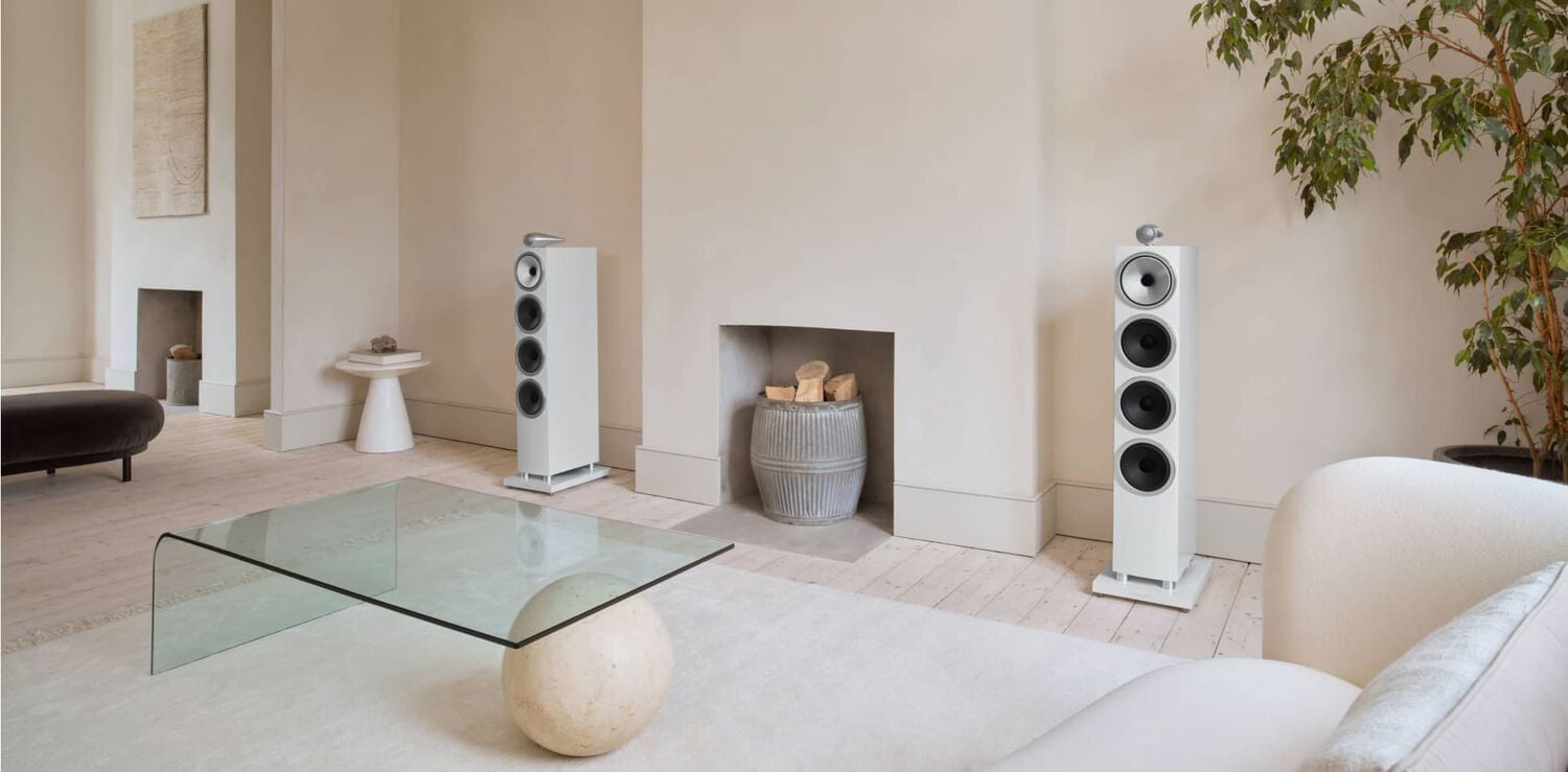 White living room with 2 large speakers