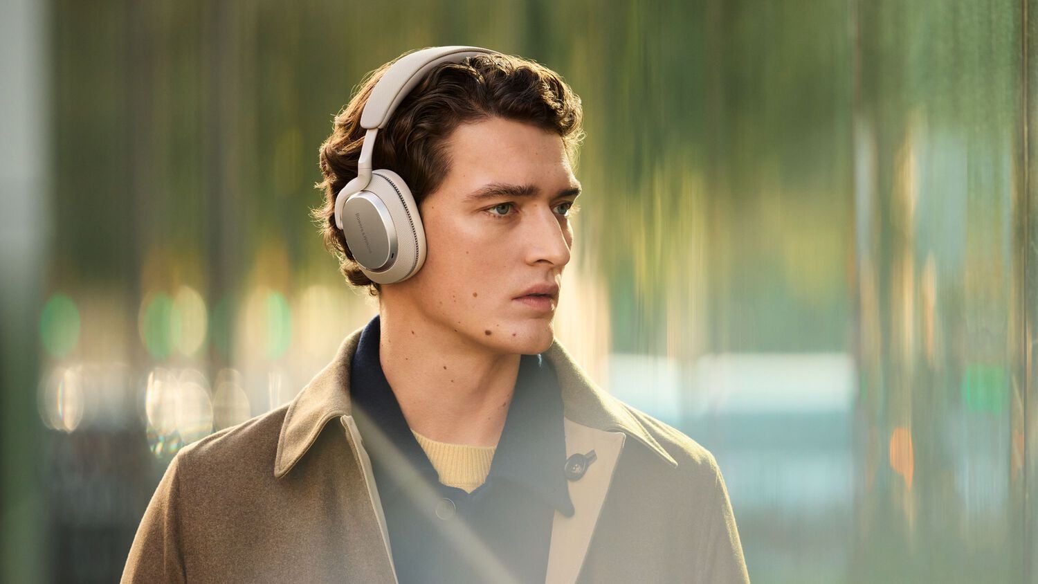 Man wearing headphones facing right