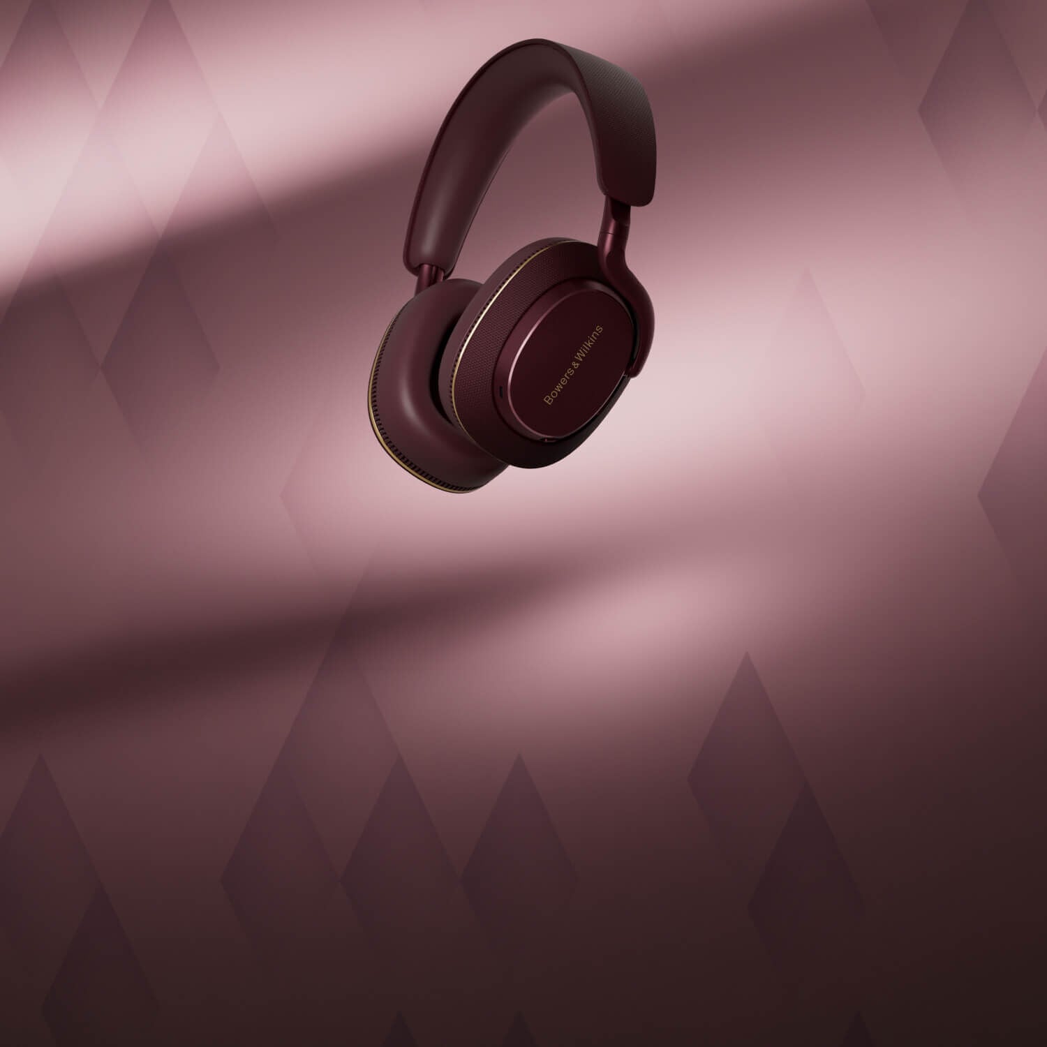 Burgundy Px7 S3 headphones with burgundy background