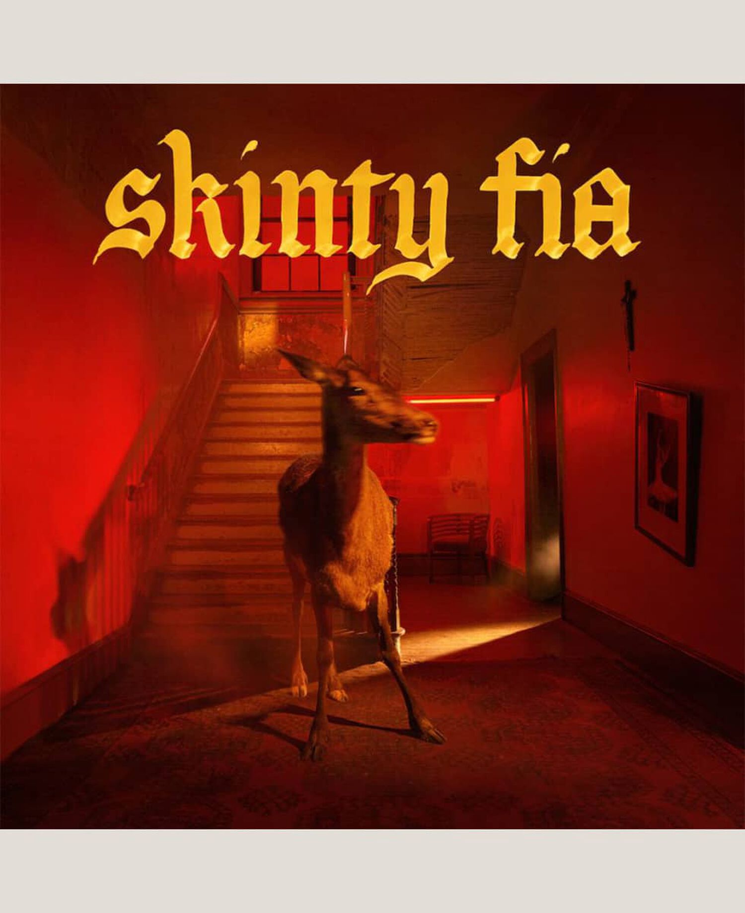 Deer in house with stairs and red lights