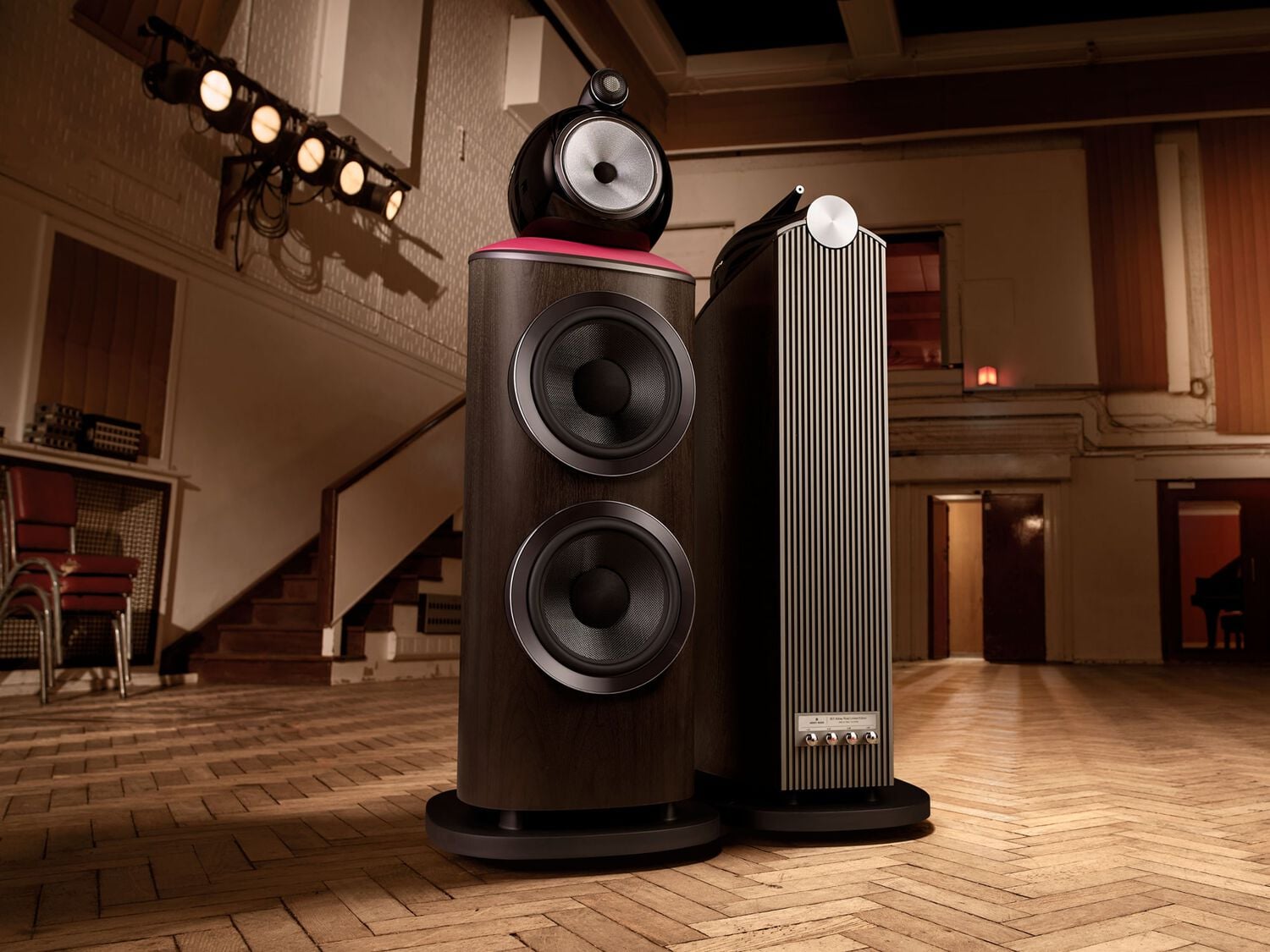 2 Black speakers facing front and back