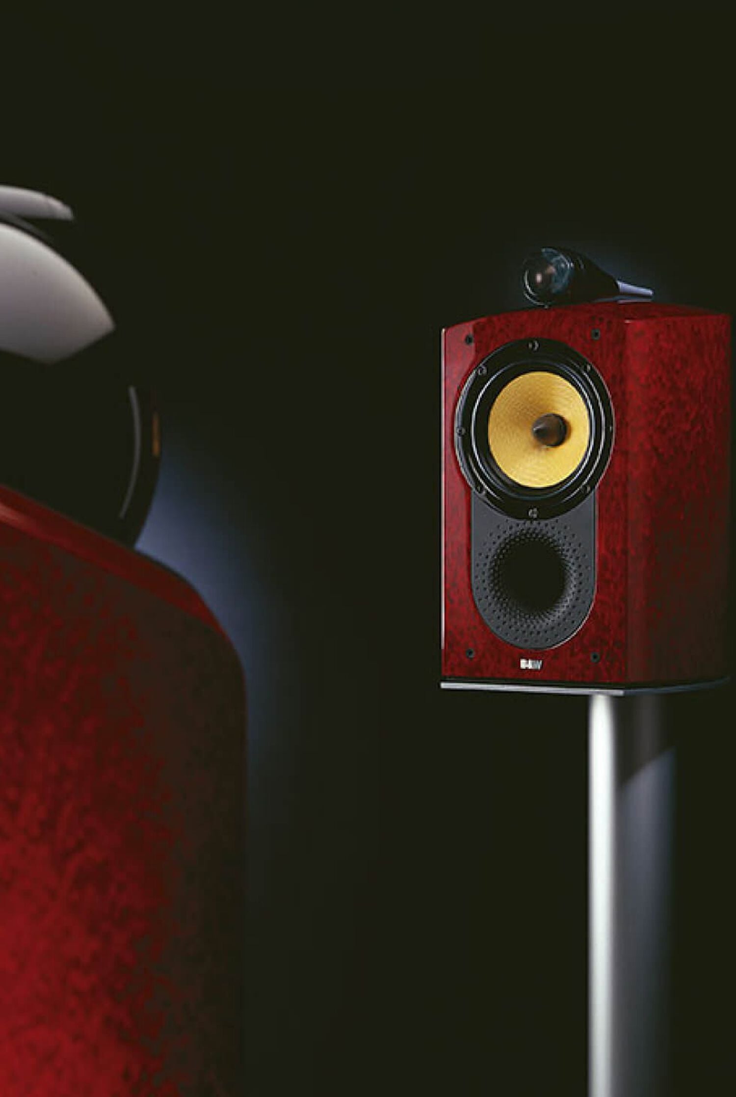 Red speaker with yellow accents front facing left