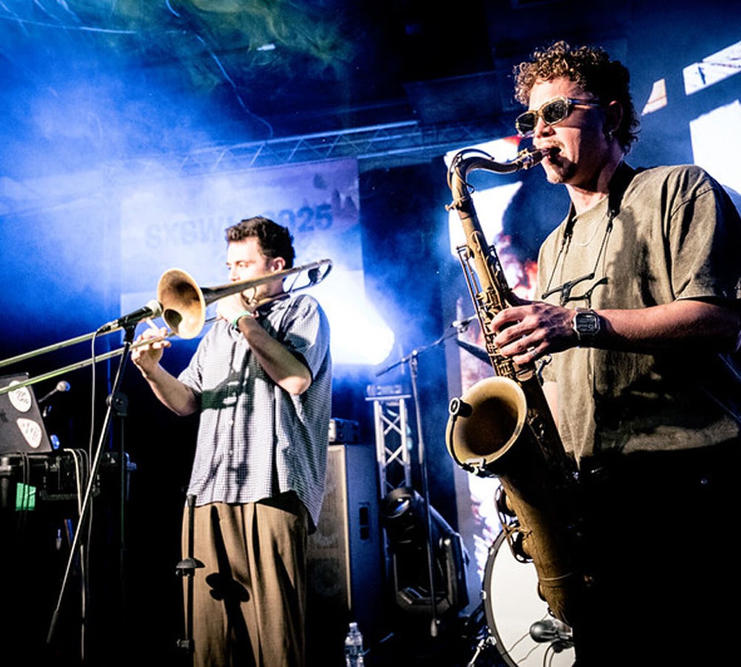 Trumpet player and saxophonist on stage