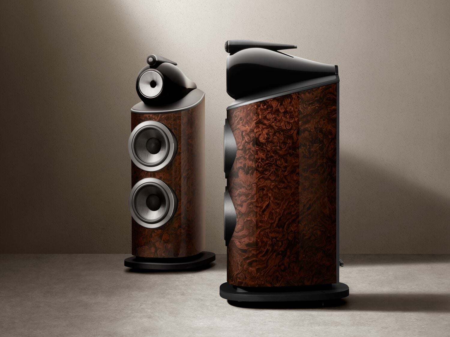 2 Dark Walnut 800 Series Signature speakers, one facing front, the other facing left