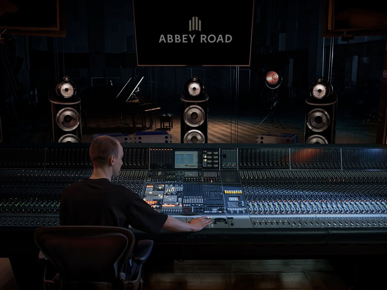 Man sitting at recording studio booth